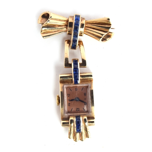 669 - AN ART DECO STYLE 9CT GOLD BROOCH WATCH
The watch with salmon dial and Arabic numerals of evens, man... 