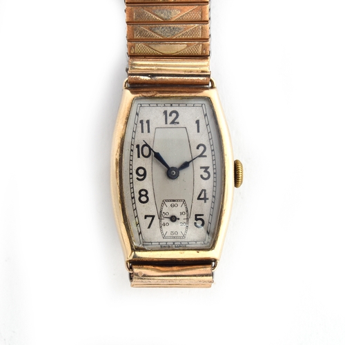 714 - A 9CT TONNEAU SHAPED 1930S GENTLEMAN'S WATCH
Engraved to the back, two tone dial with black Arabic n... 