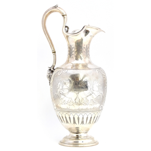 94 - A Victorian silver wine jug by Edward, John & William Barnard, London 1849, having leaf capped handl... 