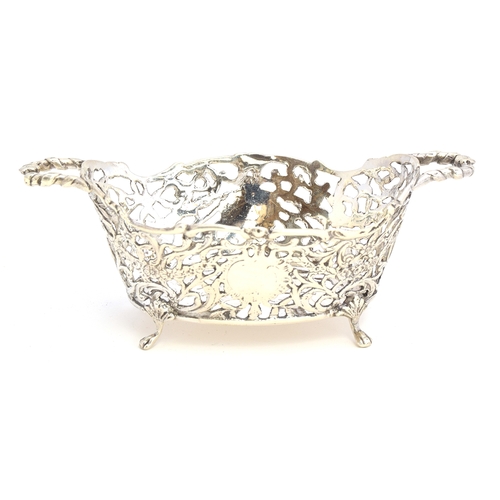 112 - A small silver sweetmeat basket by Maurice Freeman, London 1904, the pierced sides chased with folia... 