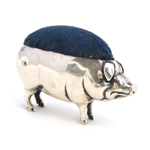 109 - An Edwardian novelty silver pig pin cushion, modelled in a standing position, marks rubbed, 8cm long