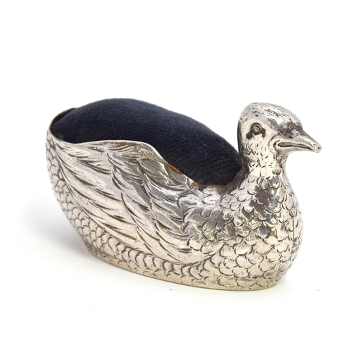 110 - A silver pin cushion in the form of a swan, marks rubbed, 7cm long