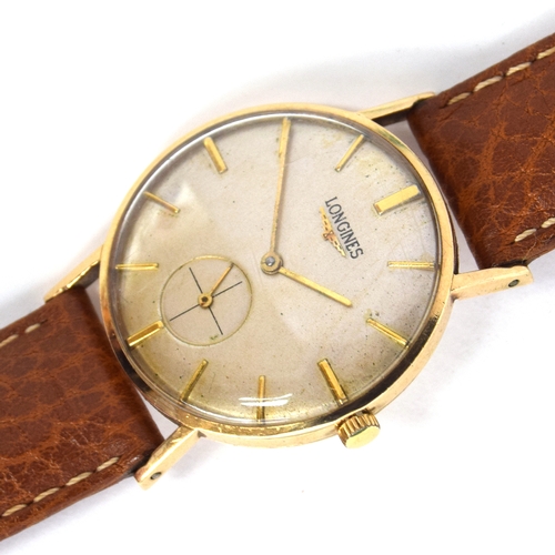 575 - A LONGINES 9CT GOLD GENTLEMAN'S MECHANICAL WRIST WATCH
Circa 1950s, cream dial, raised gold baton ma... 