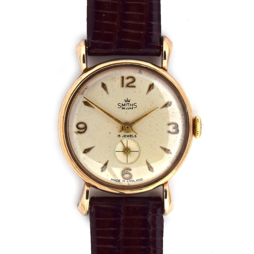 622 - A SMITHS DELUXE 9CT GOLD GENTLEMAN'S MECHANICAL WRIST WATCH
Circa 1950s, cream dial, raised Arabic n... 