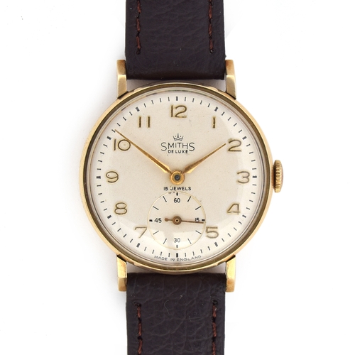 623 - A SMITHS DELUXE 9CT GOLD GENTLEMAN'S MECHANICAL WRIST WATCH
Circa 1950s, cream dial, raised Arabic n... 