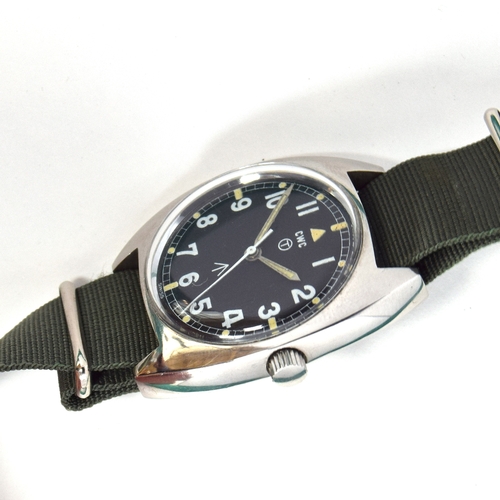 595 - A CWC W10 MILITARY STEEL WRIST WATCH
Dated 1976, black dial with luminous Arabic numerals
Movement: ... 