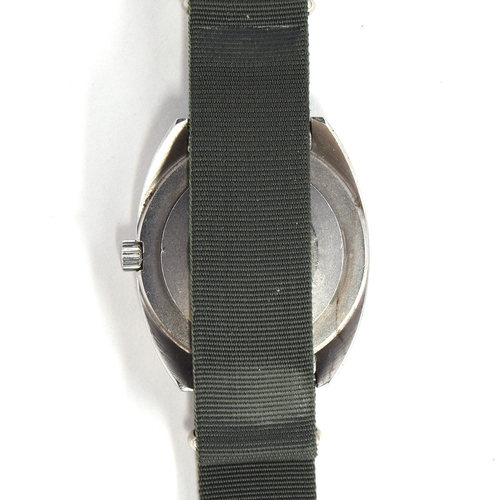 595 - A CWC W10 MILITARY STEEL WRIST WATCH
Dated 1976, black dial with luminous Arabic numerals
Movement: ... 