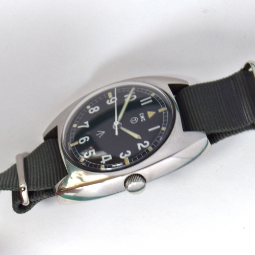 596 - A CWC W10 MILITARY STEEL WRIST WATCH
Dated 1979, black dial with luminous Arabic numerals
Movement: ... 