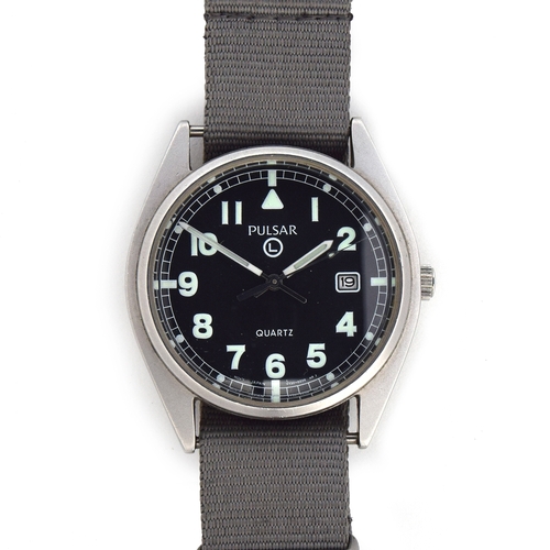 663 - A PULSAR QUARTZ MILITARY STEEL WRIST WATCH
Dated 2002, case back etched with broad arrow above P1139... 