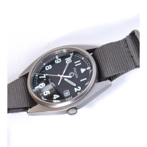 663 - A PULSAR QUARTZ MILITARY STEEL WRIST WATCH
Dated 2002, case back etched with broad arrow above P1139... 