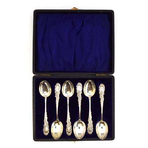 126 - A cased set of six coffee spoons by Crisford & Norris Ltd, Birmingham, the scrolling terminals monog... 