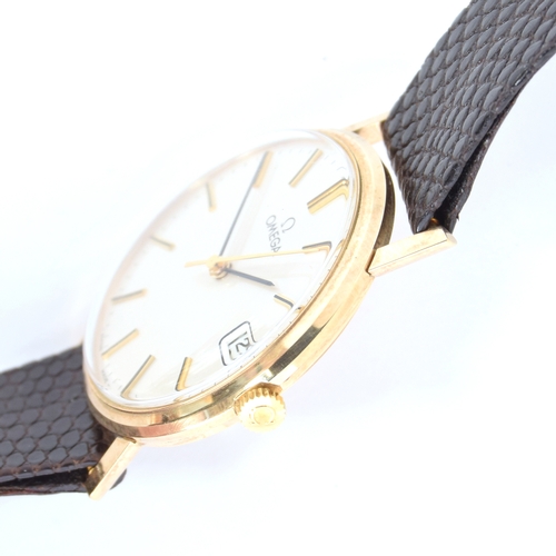 526 - AN OMEGA 9CT GOLD GENTLEMAN'S WRIST WATCH
1970s, off white dial, raised baton markers, presentation ... 