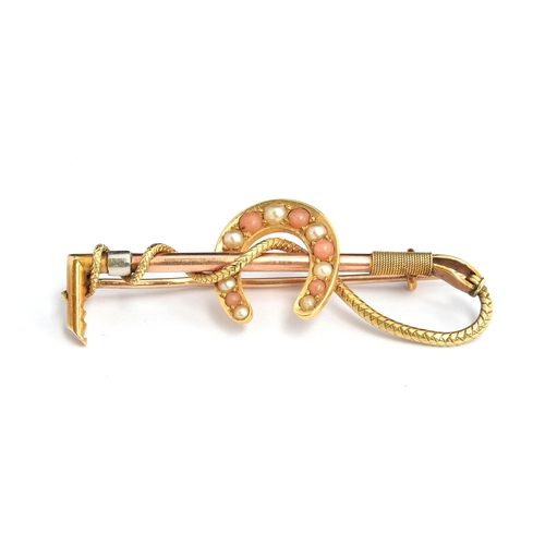 23 - A yellow metal brooch in the form of a horseshoe and riding crop set with seed pearls, 5.7g, length ... 