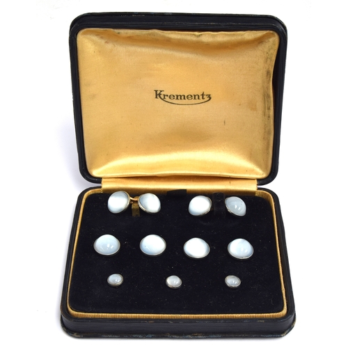 27 - A cased set of moonstone dress studs, comprising two cufflinks, four buttons and three studs; togeth... 