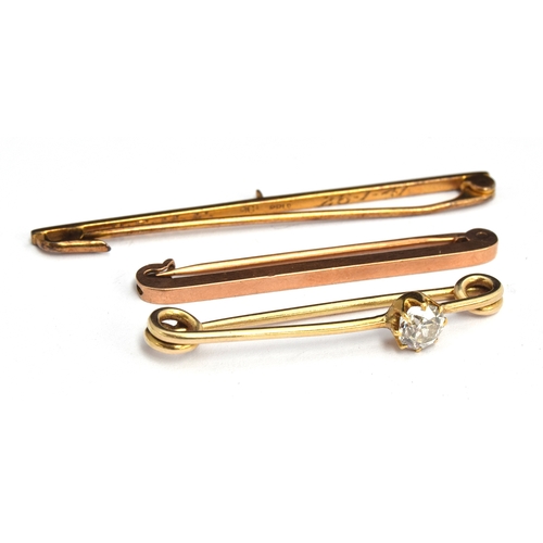 40 - A 0.5 carat solitaire diamond set bar brooch in a Cartier box; together two other 9ct bar brooches (... 