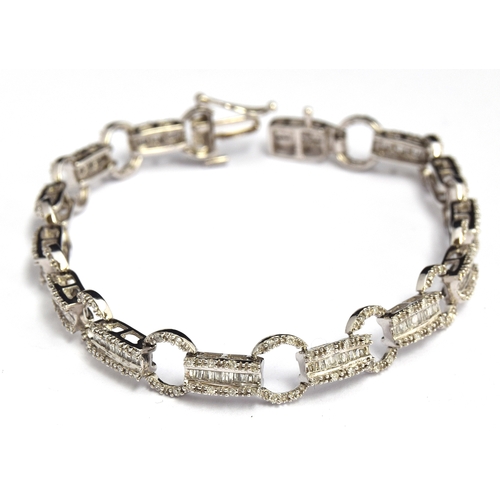 69 - A 9ct white gold diamond bracelet, gross weight 10g