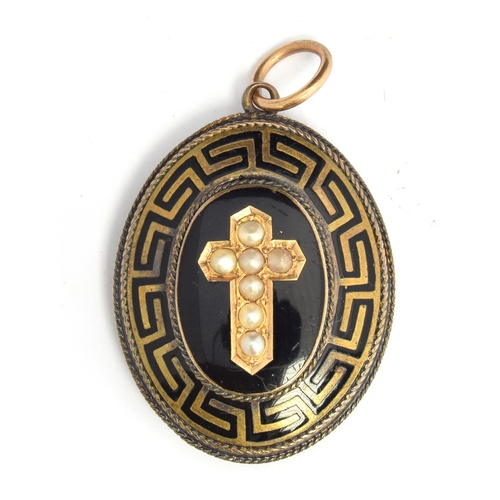 81 - A Victorian mourning locket featuring a crucifix decorated with seed pearls