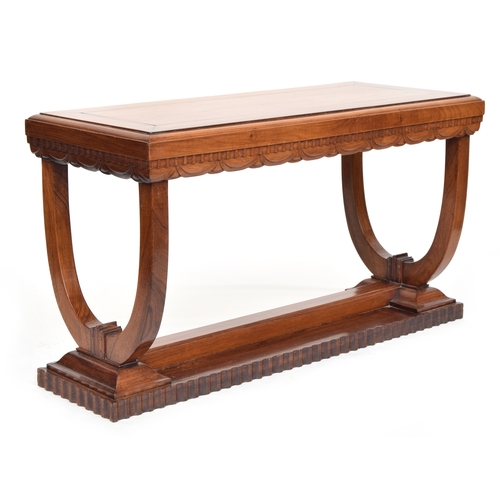 513 - A French Art Deco rosewood console table, carved with dentil frieze above swags, raised no two U sup... 