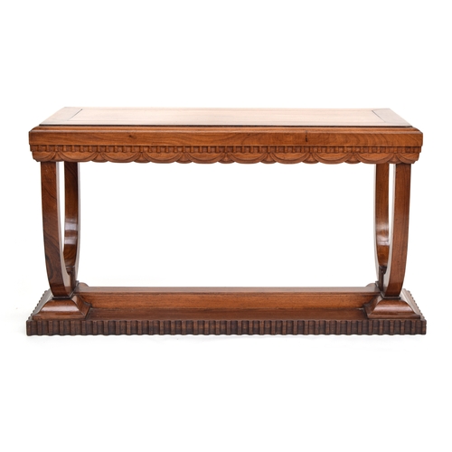 513 - A French Art Deco rosewood console table, carved with dentil frieze above swags, raised no two U sup... 