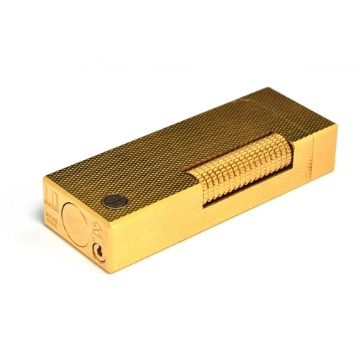 89 - A gold plated Dunhill Rollagas lighter with engine turned decoration, 6.4cm high, in fitted Dunhill ... 