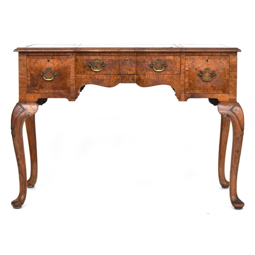 486 - A Maple & Co burr walnut desk, the shaped frieze drawer flanked by two further drawers, on cabriole ... 