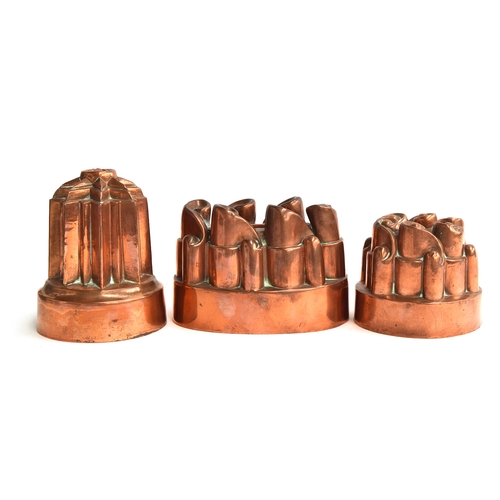 491 - Three 19th century copper jelly moulds, one by Benham & Froud, 12cm diameter x 15cm high, the others... 