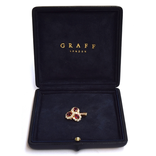 48 - An 18ct gold Graff pendant/brooch set with diamonds and rubies in three cluster heads. Unmarked but ... 