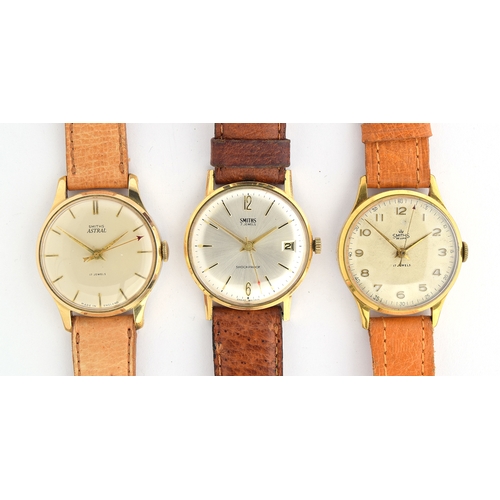 634 - Three Smiths steel and gold plated manual watches, between 30 and 33mm, all with leather straps