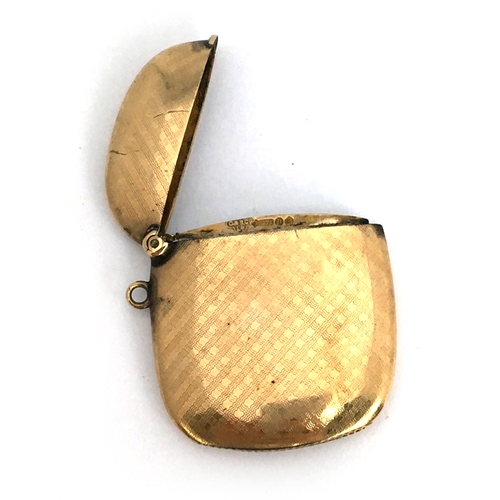 89A - A 9ct gold vesta case, of slender cushion form, with engine-turned decoration, London, C&S Co, 1908,... 