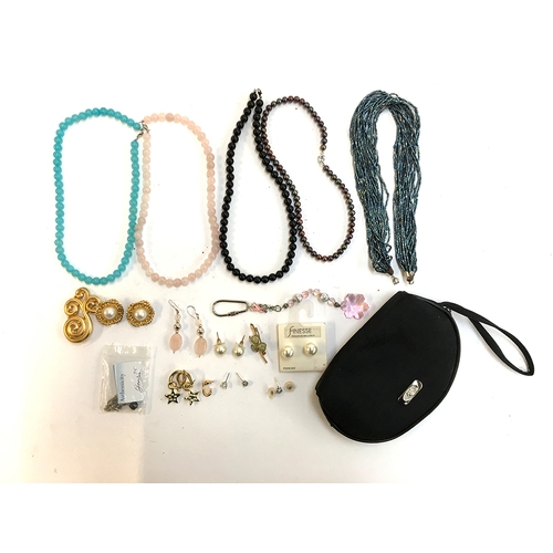 13 - Three sets of beads on silver clasps together with miscellaneous costume jewellery in a black bag