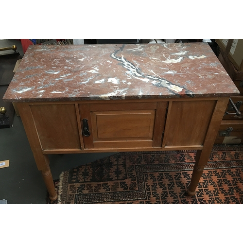 722 - A marble topped kitchen unit