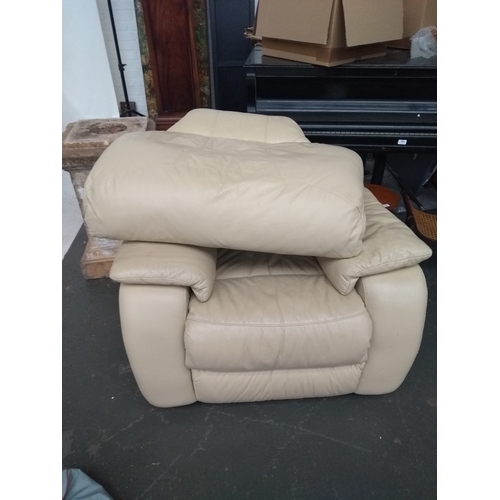 723 - A cream leather reclining armchair