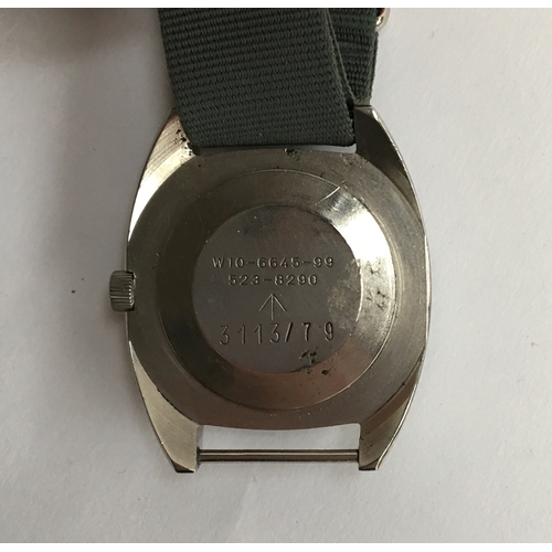 596 - A CWC W10 MILITARY STEEL WRIST WATCH
Dated 1979, black dial with luminous Arabic numerals
Movement: ... 