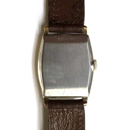 581 - A BULOVA GENTLEMAN'S GOLD FILLED WATCH
Circa 1940s, black dial with Arabic numbers, steel back
Movem... 