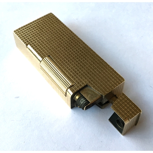 87 - A 9ct gold Dunhill 'Rollagas' lighter, engine turned decoration to case, 5.9cm long, gross weight 73... 