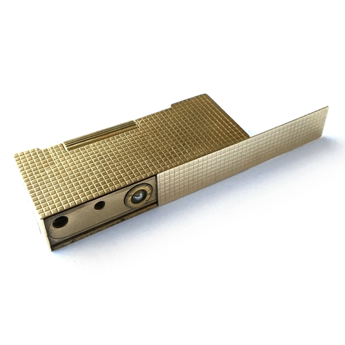 87 - A 9ct gold Dunhill 'Rollagas' lighter, engine turned decoration to case, 5.9cm long, gross weight 73... 