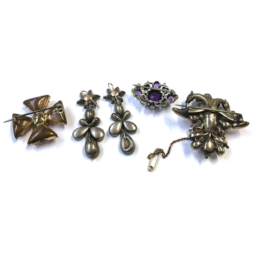 42 - A double headed eagle brooch with a 9ct gold safety chain; together with drop earrings (some damage)... 