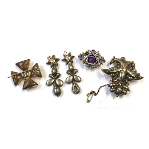 42 - A double headed eagle brooch with a 9ct gold safety chain; together with drop earrings (some damage)... 