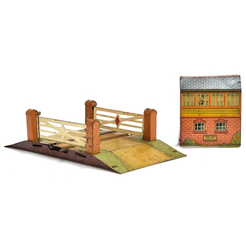 881 - A Hornby O gauge tinplated lean to signal box, 10cmH; together with a Hornby O gauge level crossing ... 