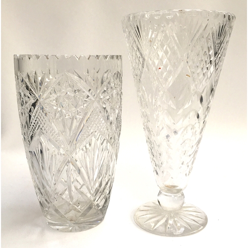 70 - A crystal conical vase, 31cmH; together with a crystal vase with cut star design, 26cmH (2)