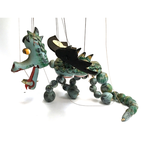 1036 - A Pelham Puppet 'Mother Dragon', wooden body with felt wings; together with 'Baby Dragon', wooden bo... 