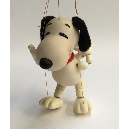 1037 - A Pelham Puppet Snoopy, plastic body with felt ears and collar; together with a Pelham Puppet Orinoc... 