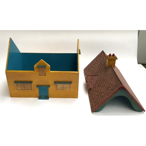 1023 - A wooden painted dolls house with removable roof