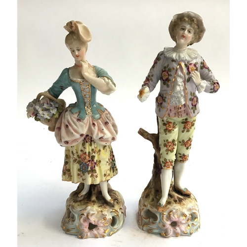 61 - A pair of continental style figurines of a young man and woman (af), intricately hand painted with f... 