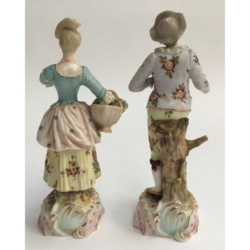 61 - A pair of continental style figurines of a young man and woman (af), intricately hand painted with f... 