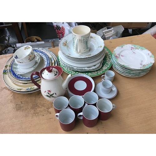 63 - A mixed lot of china to include a German coffee set, and a quantity of plates and meat plates