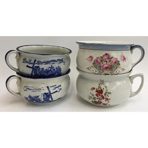 106 - A pair of blue and white 'Empire Ware' chamberpots, together with two others (4)