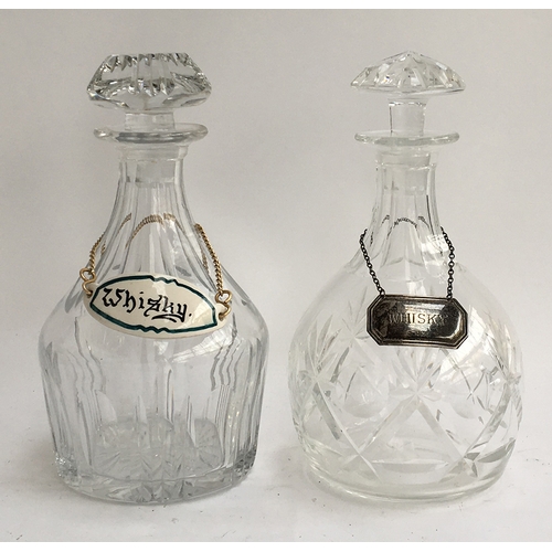 81 - Two heavy glass decanters with whiskey labels (one silver, one ceramics)