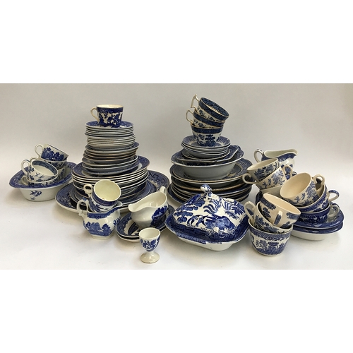 110 - A very large collection of blue and white Willow pattern dinnerware and teaware, to include Booths, ... 