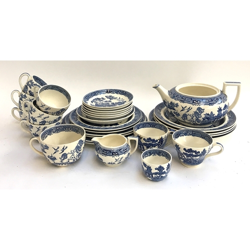 112 - A Wedgwood willow pattern teaset to include six cups and saucers, various plates, milk jug and sugar... 